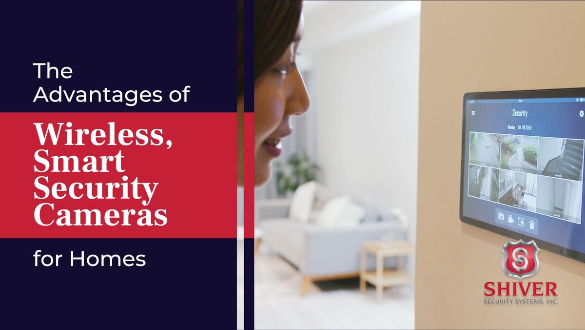 A woman looking at a home security system screen